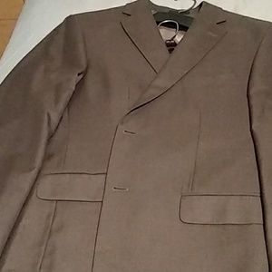 One male green suit. White shirt. Leather jacket